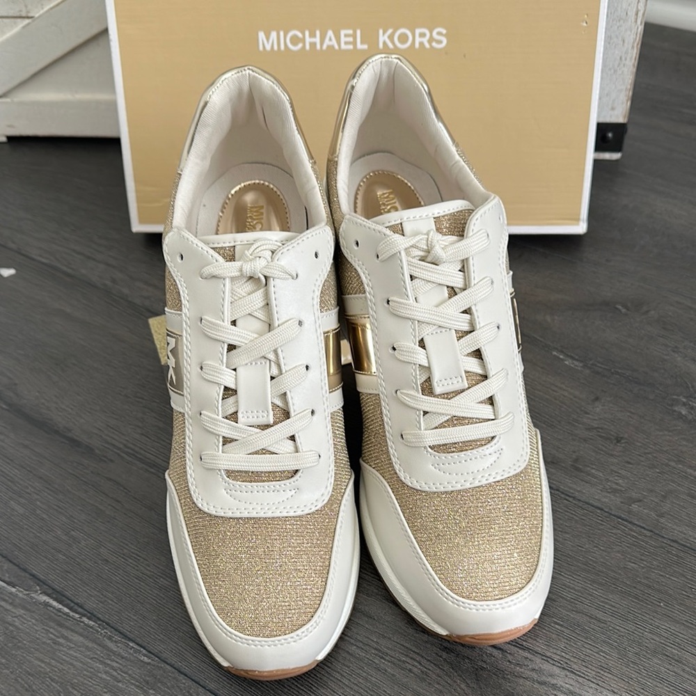 Michael Michael Kors Mabel Trainer with a glittery gold.